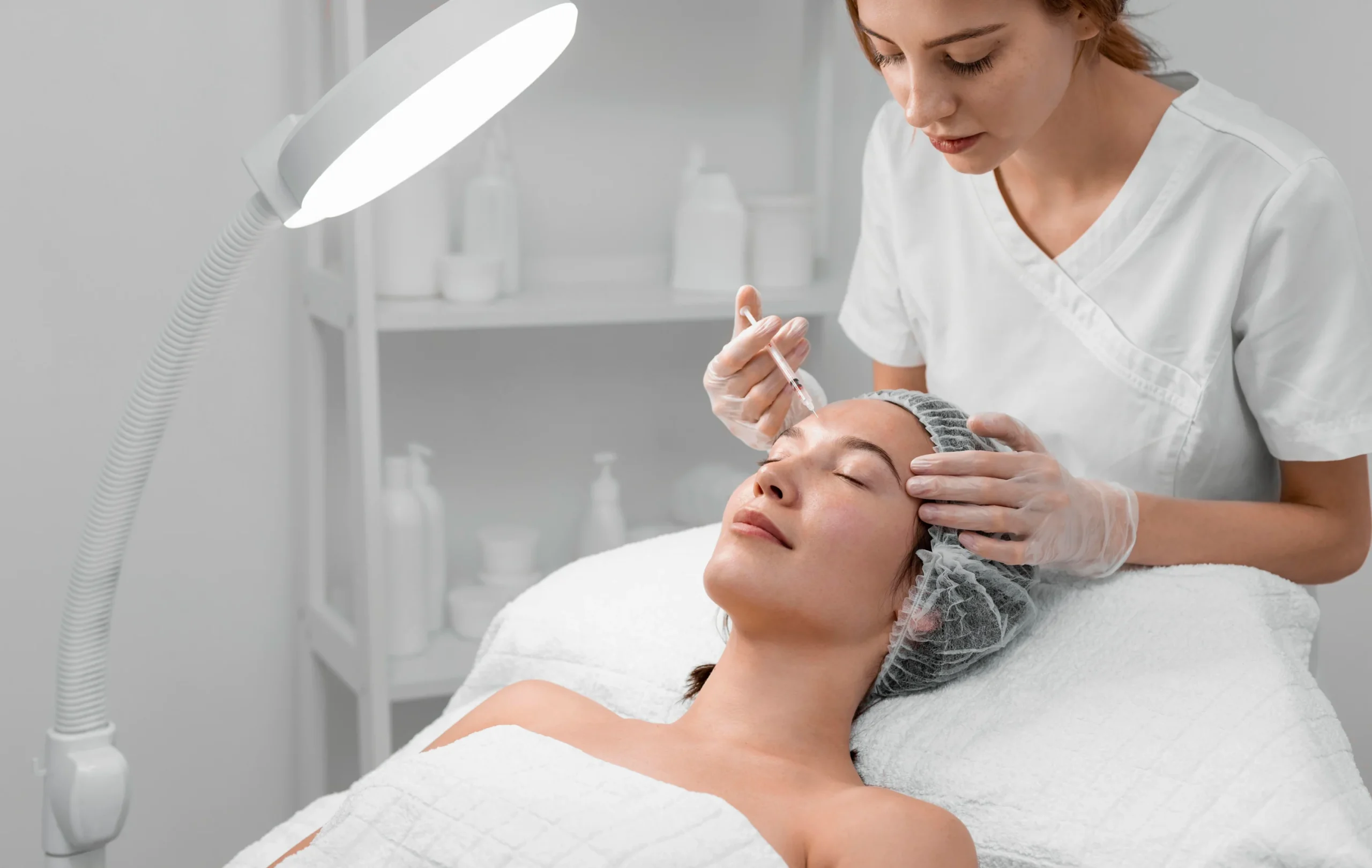 beautician-doing-filler-injection-female-client - SYNC Life Botox Xeomin treatments