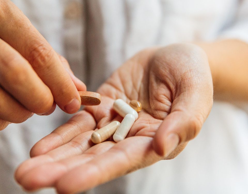 hands holding 5 supplements, 3 Reasons to Order Vitamins